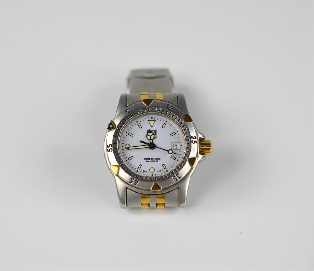 Tag Heuer ladies two-tone wristwatch: Professional, 200 metres, stainless steel, serial number WD1421.