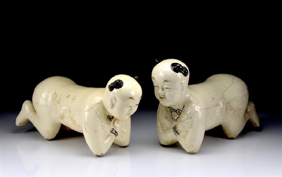 TWO CHINESE CIZHOU CERAMIC FIGURAL PILLOWS (1 of 1)