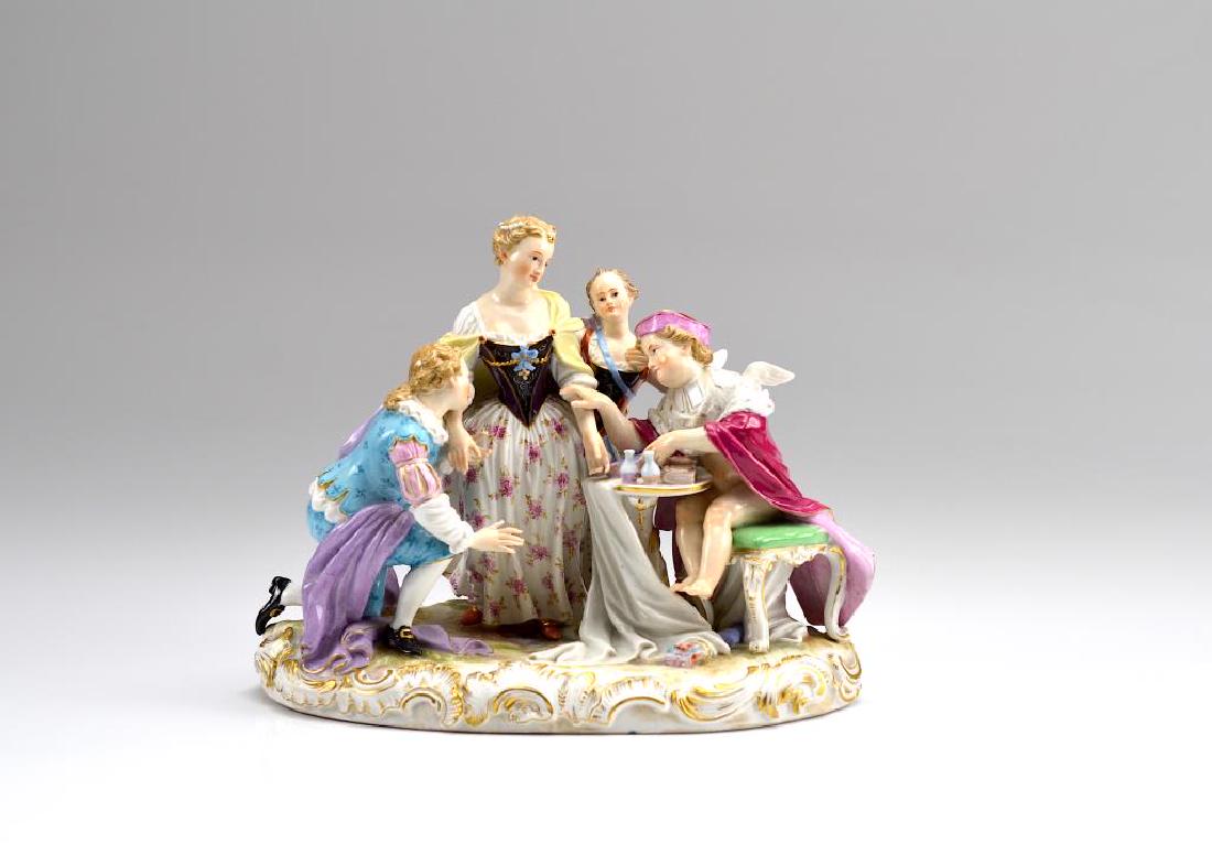 MEISSEN PORCELAIN FIGURAL GROUP: Of a proposal of marriage with the bride and groom standing next to a cupid figure at a table with wine and prayer book, crossed sword marks to base and impressed numbers. H 18 cm (7 1/8in)Restoration
