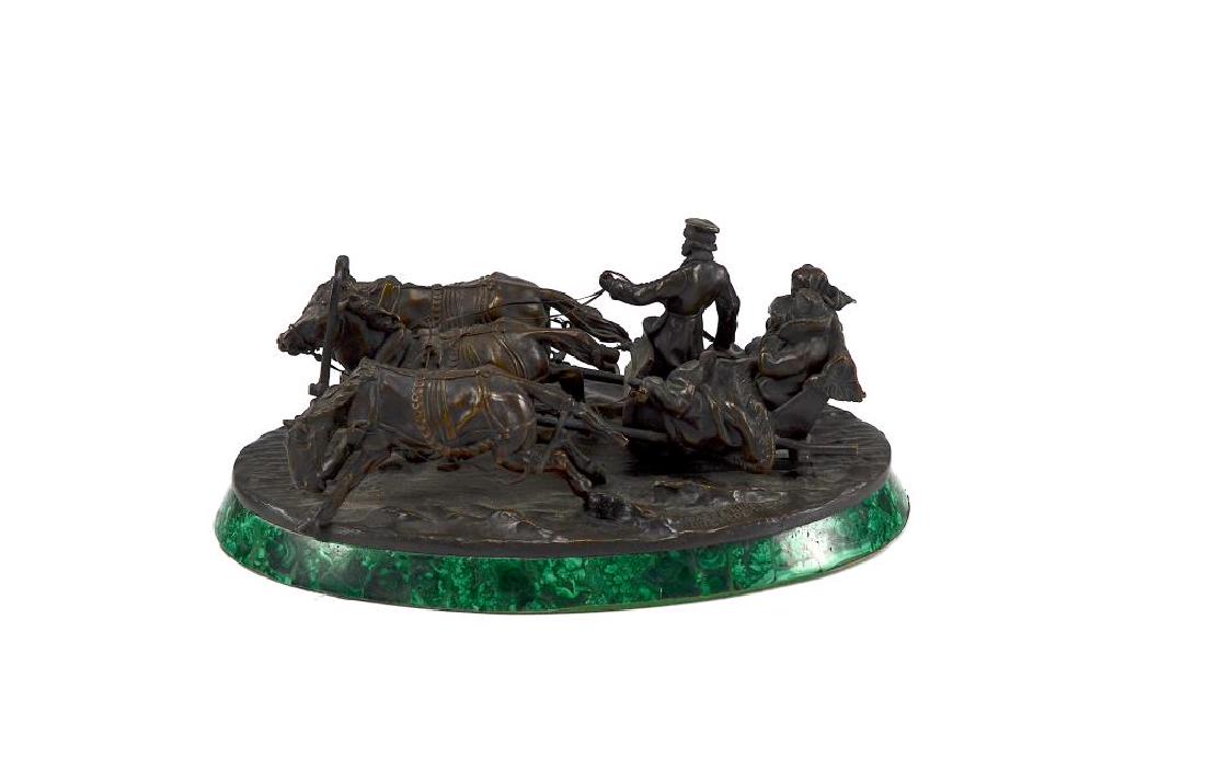 RUSSIAN BRONZE SCULPTURE ON MALACHITE BASE: By Vassily Grachev of Travellers in a Troika. Base signed and titled in Cyrillic. L. 25.5 cm (10 in.)