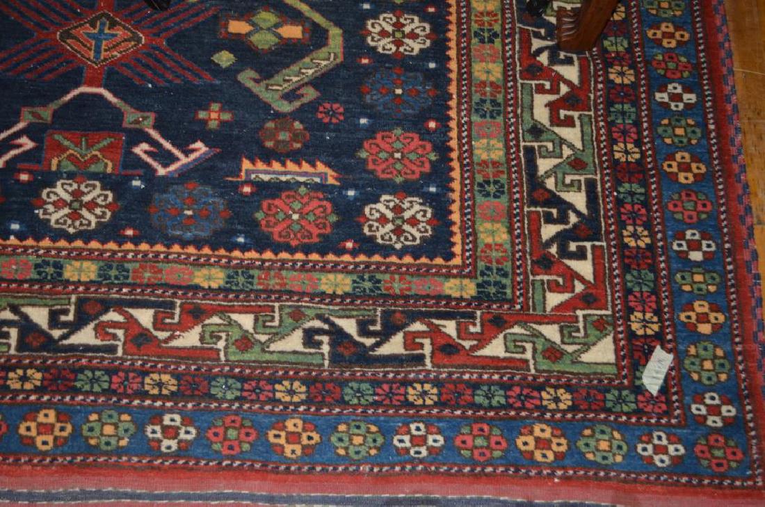 Navy and red ground geometric rug (1 of 2)