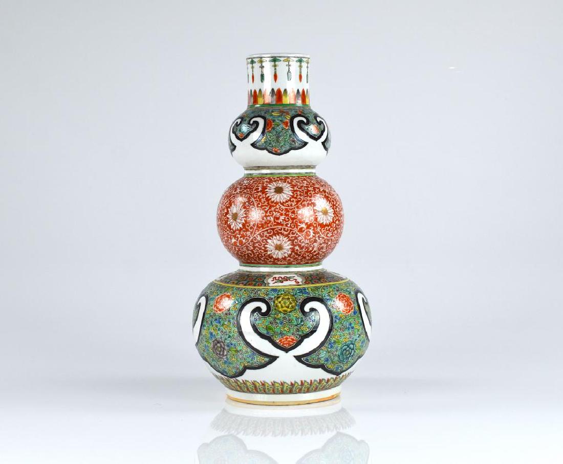 CHINESE ISLAMIC MARKET TRIPLE GOURD PORCELAIN VASE: Top and bottom bulb with turquoise ground famille rose floral decorations. Middle bulb with coral florals. H. 38cm (15 in.)