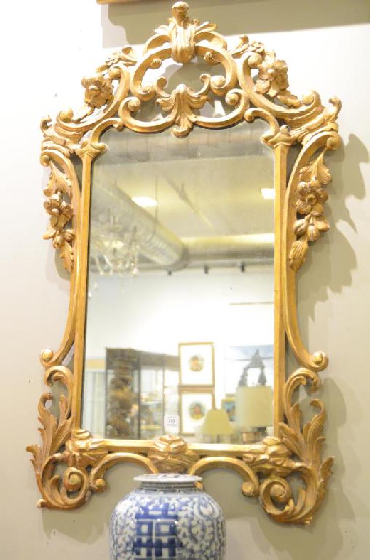 Antique carved giltwood framed mirror: H. 94 cm (37 in), W. 53 1/4 cm (21 in)