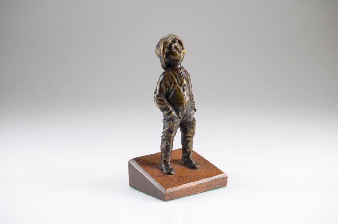 Decorative bronze sculpture of a young fisherman: Of a young man in waders and overalls smoking a cigarette atop a wood base. After Julius Schmid-Felling. H. 20.3 cm (8 in.)