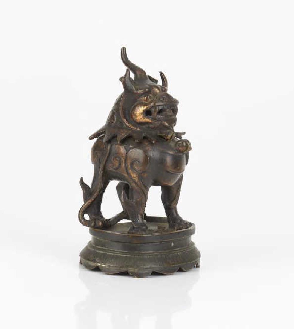 CHINESE MYTHICAL BEAST FORM BRONZE CENSER: As a Lu Duan on a lotus platform. Head detached from body. Late Ming to early Qing dynasty. H. 18cm (7 in.)