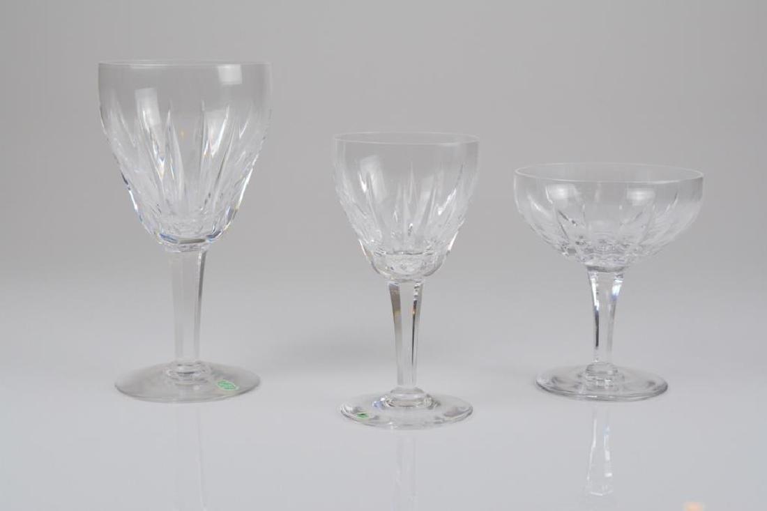 Assorted Stuart Monaco glass stemware: Assorted Stuart Monaco glass stemware Includes eight wine glasses, eight champagne glasses and eight smaller glasses. H. of wine glass: 17.5 cm (6 7/8 in.)