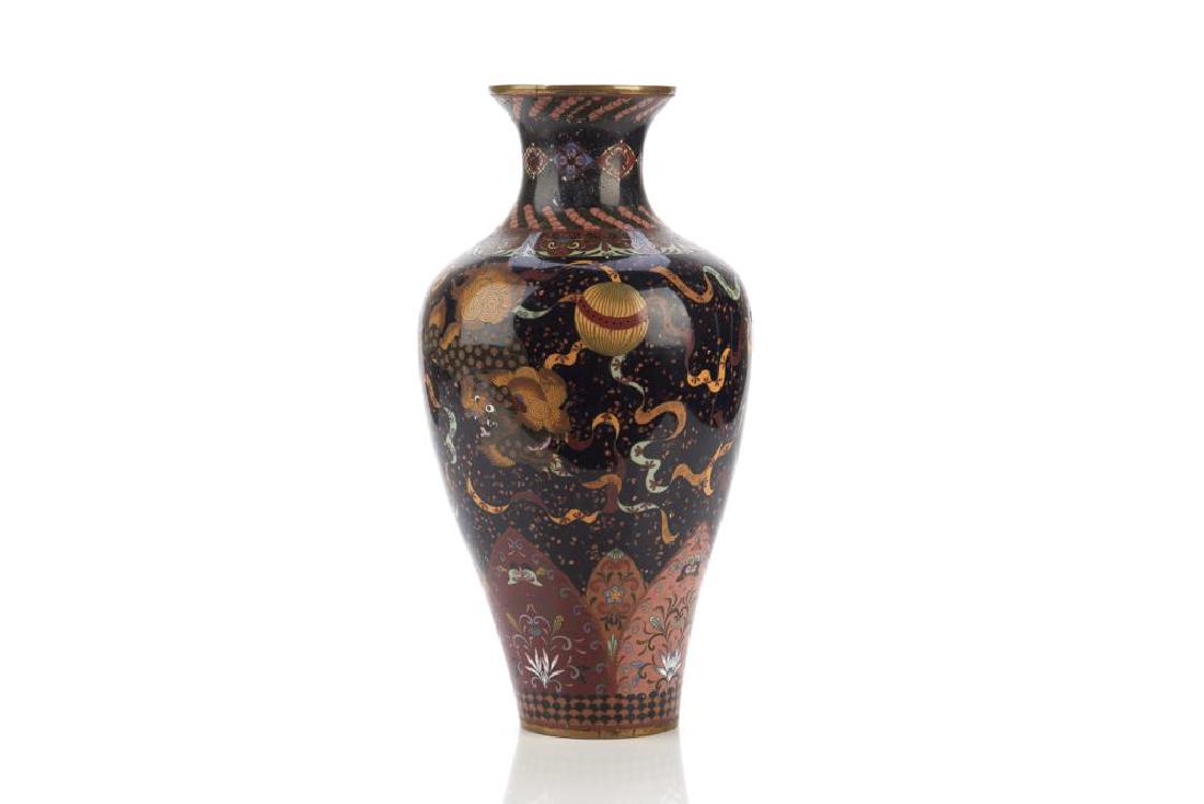 JAPANESE CLOISONNE ENAMELLED VASE: Black ground decorated with lion dogs playing with silk balls, with lappet borders and gold speckled patterns. Meiji period, 19th C. H. 36cm (14 1/4 in.)