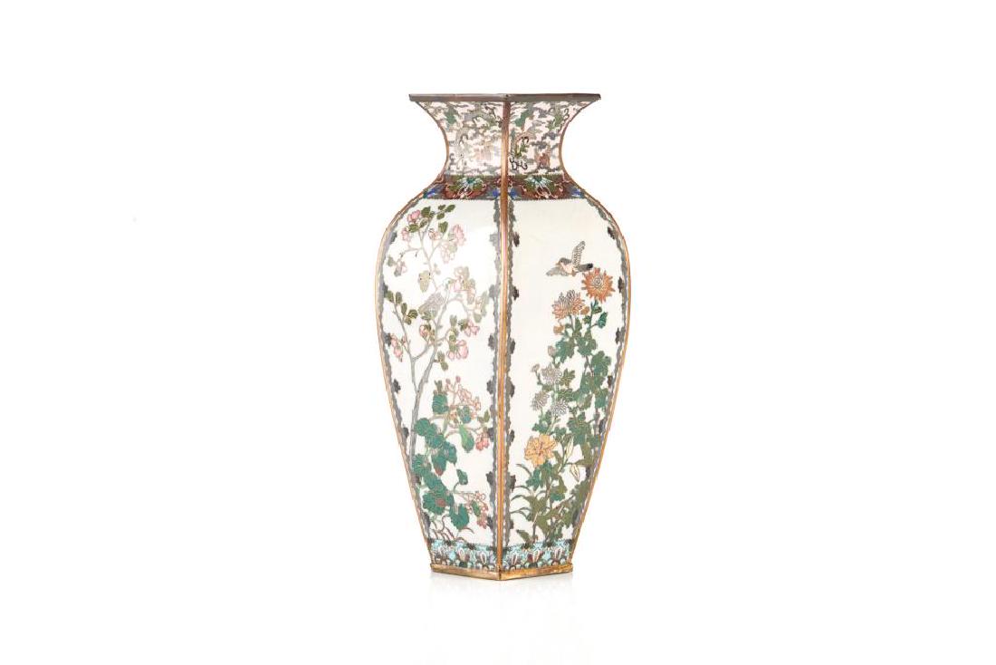 JAPANESE CLOISONNE ENAMELLED FOUR SIDED VASE: Each side with a bird and flower scene to body. Phoenix floral band to neck. Interior and based enamelled in turquoise. Meiji period. H. 25.5cm (10 in.)
