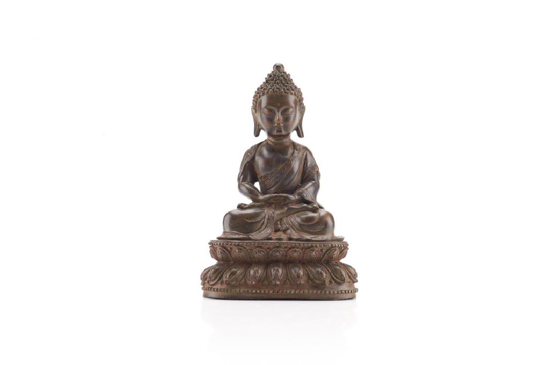 CHINESE BRONZE FIGURE OF SEATED BUDDHA: Cast with the Buddha sitting on a double lotus throne in a seated meditation pose. Qing dynasty. H. 16.5cm (6 1/2 in.)