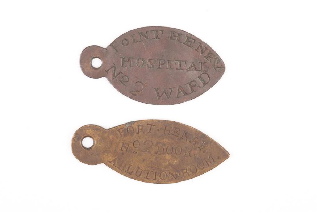 Two military copper hospital key tags (1 of 4)