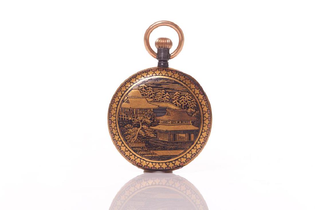 Antique Tavannes pocket watch with Japanese case: The case is decorated in gold and japanned Komai mixed metal dragons and pagodas. The interior inlay with a monogram.