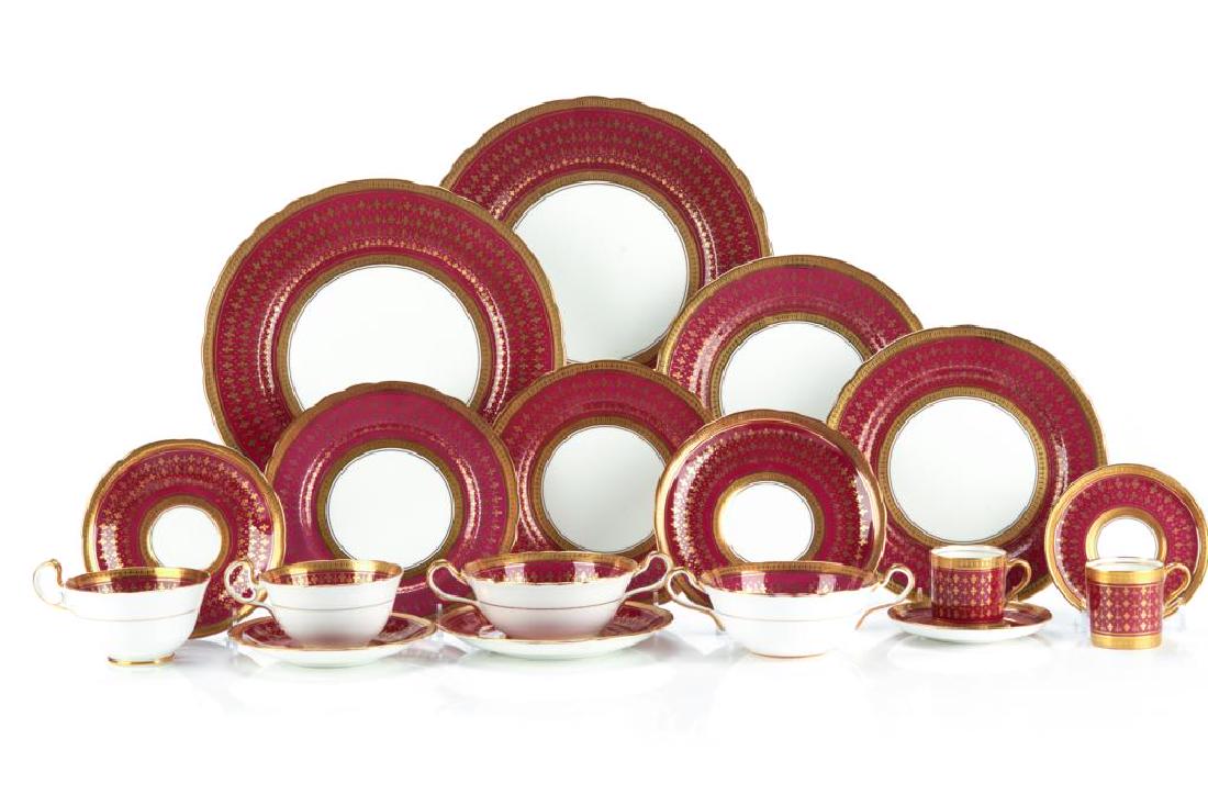 Aynsley 6947 porcelain dinner service: The burgundy and gilt border dinner set includes twelve dinner plates, twelve dessert plates, eight bread and butter plates, eight soup bowls, eleven demi-tasse cups and saucers with an additionalsauc