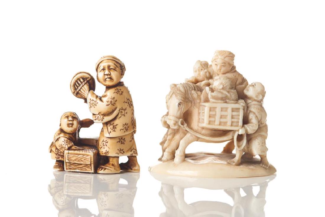 TWO JAPANESE CARVED NETSUKES: The larger carved as a family of five traveling with a horse, base marked Somei. The other of a father and child street vendor group. Meiji period (1867-1912). H. 4cm (1 1/2 in.)