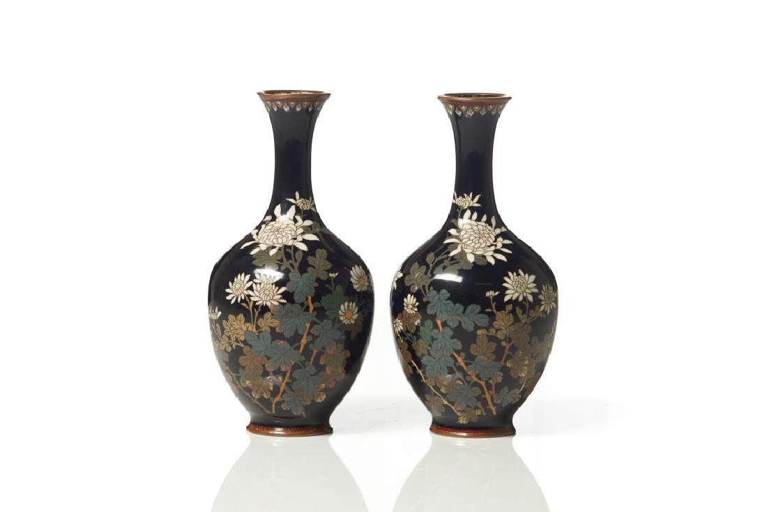 PAIR OF JAPANESE CLOISONNE ENAMELED VASES: Dark piano black ground featuring a white chrysanthemum motif, dark brown body. Meiji period, late 19th to early 20th C. H. 24cm (9 1/2 in.)