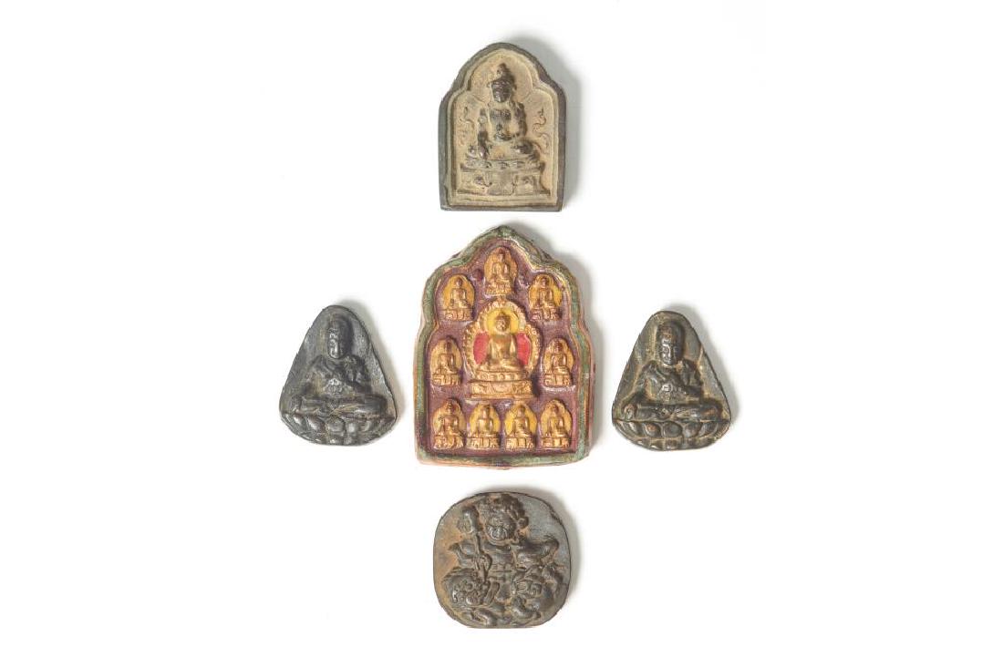 GROUP OF FIVE TIBETAN BUDDHIST TSA TSA: Including four cast bronze tsa tsa, three with Tibetan inscriptions to back, and one with a cross vajra to back. The other of a molded terracotta painted on one side. Tallest: 9cm (3 1/2 in.)