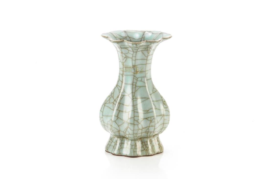 CHINESE GE WARE STYLE CRACKLED CELADON VASE: Floral form ribbed body with heavy crackling on a celadon body. H. 19cm (7 1/2 in.)
