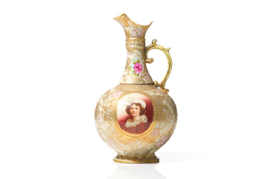 Japanese porcelain portrait ewer: Medallions with cabbage rose bouquets surrounded by gilt foliate and floral decoration, and a portrait medallion of a young girl to one side, probably Nippon. H. 32.7 cm (12 7/8 in.)