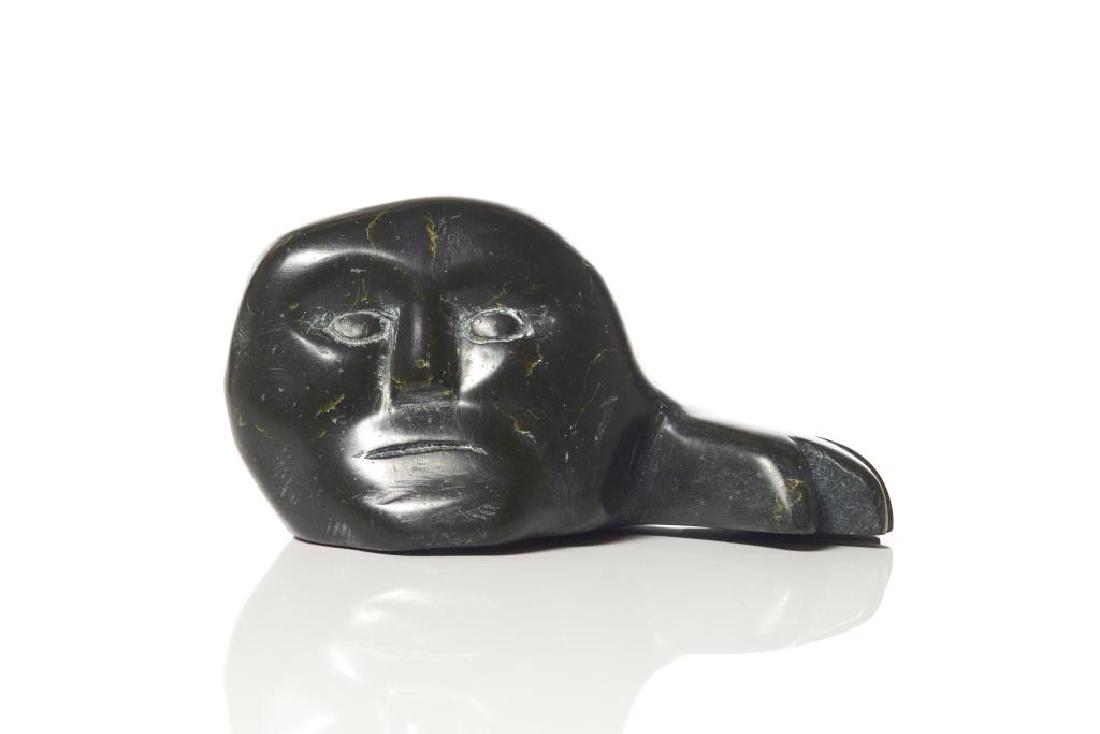 KOVEYOOK NOTSIAPIC (b. 1909): Qikitarjuaq (Broughton Island)FaceCarved soapstone Signed in syllabics and disc no. to baseH. 9cm (3 3/4 in.)