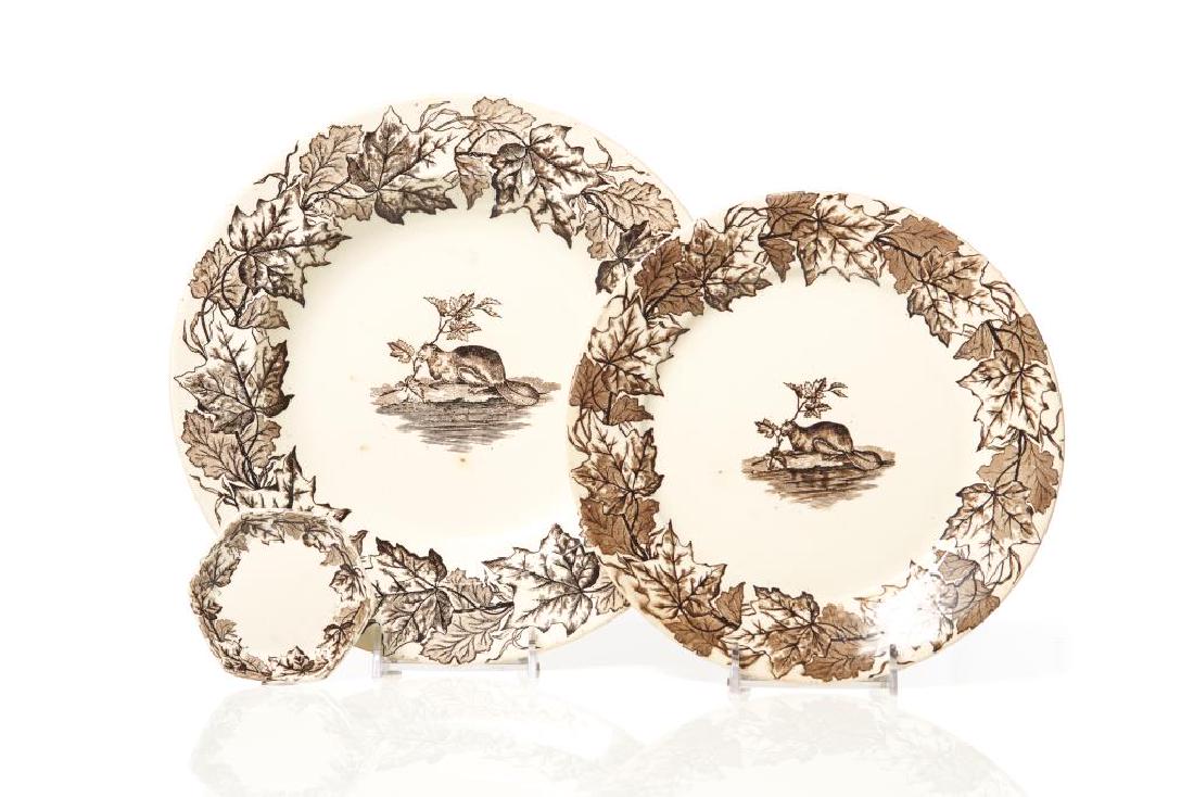 Furnival Maple pattern plates and butter pat: the plate and rim soup bowl transfer printed in brown with a central beaver and border of maple leaves, the hexagonal butter pat with border only, T. Furnival & Sons, late 19th C. D. 24.5 cm (93/4 in.