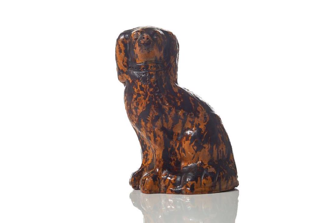 Canadian redware pottery spaniel: Mottled glaze. Daniel Orth Campden, Lincoln County, Ontario, 1893 incised marks to base. 19th C. H. 23.5 cm (9 1/4 in.) stress crack with some chips along top mold seamline, minor loss of glaze on nos