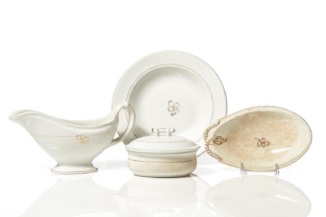 Lot of St. Johns Ironstone gilt decorated wares: comprising gravy boat, relish dish and soup bowl with clover leaf decoration and a soap dish, liner & cover with gilt highlights, various printed marks