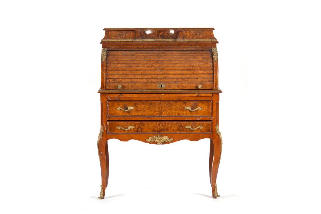 Continental burled walnut roll top desk: Inlaid with ormolu mounts. H. 46 in, W. 33.5 in, D. 18 1/4 in.