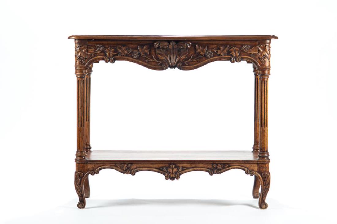French country buffet: Two tiered with an open lower shelf, foliate carved apron and single drawer. 36 1/2 in. x 43 1/4 in. x 21 3/4 in.