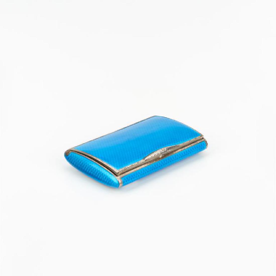 Silver & enamel hinged snuff box: Turquoise blue guilloche enamel pillow form box with bright cut borders and gilt washed interior, with Russian hallmarks. 117g, L 3 3/8in. Minor enamel loss on one side in the corner.