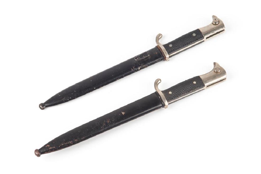 Two WW II German bayonets: One by Robert Klaas the other by Paul Seilmeiner both of Solingen Germany. Total length 35 cm (13 3/4 in.)