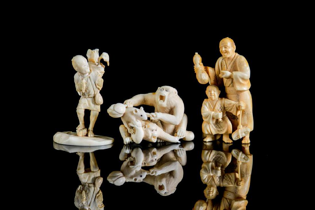THREE JAPANESE NATURAL CARVED OKIMONO: First of a father and son group with the father holding an eggplant, signed Tenzan. Second of a man with a basket on back, signed Shogetsu. The third of a monkey and mouse group with inlaideyes. 19th 