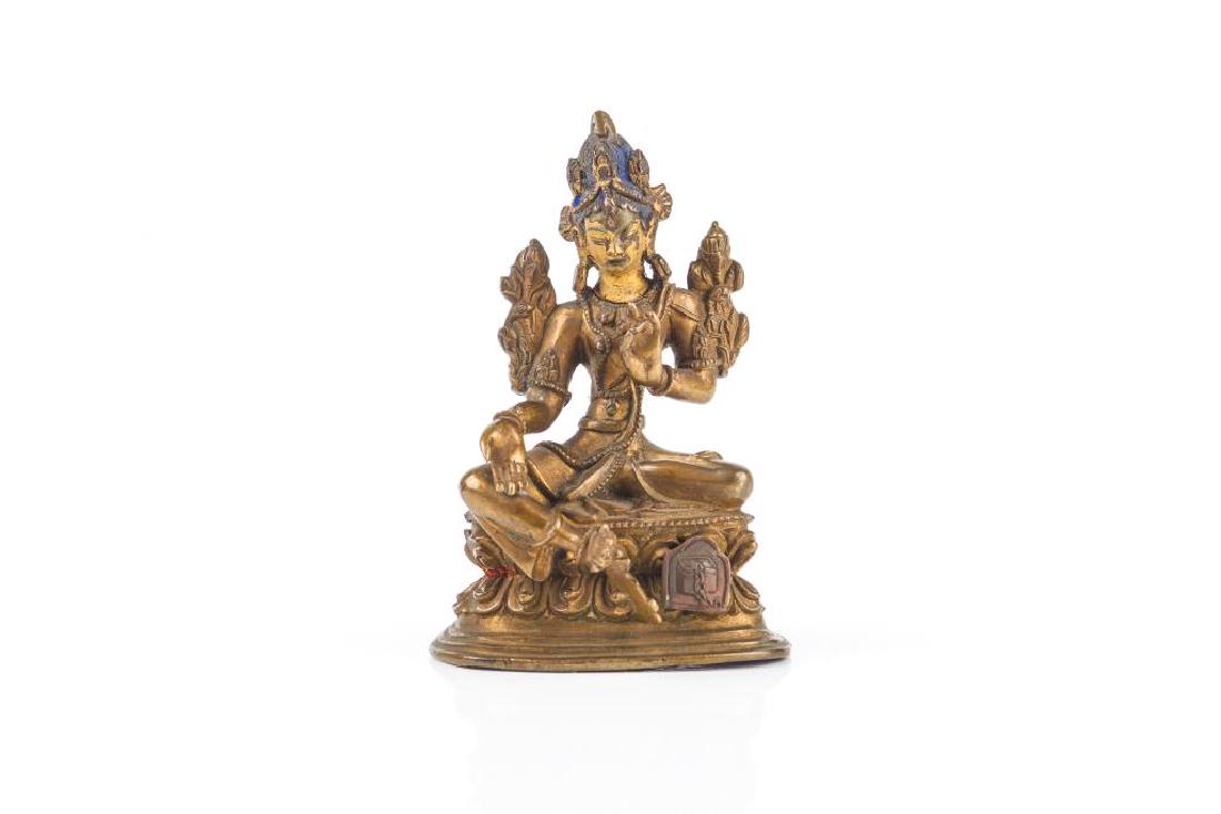 19TH C. TIBETAN BRONZE TARA FIGURE: The Tara seated in lalitasana position on double-lotus base, her right hand in varadha mudra and her left hand in kartari mudra, flanked by large lotus buds on either side. Blue pigment tohair, and go