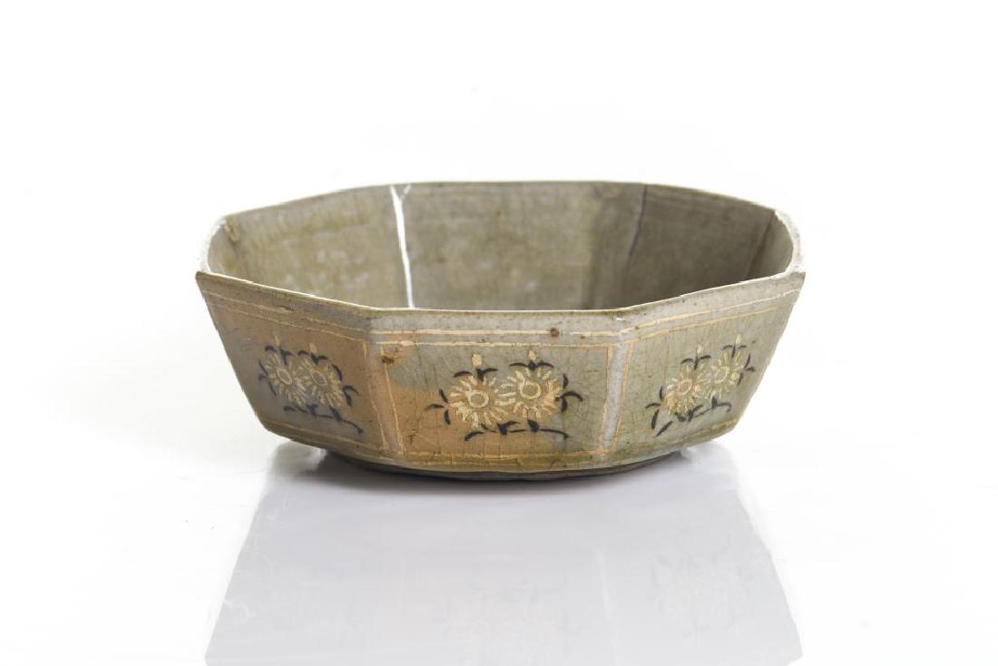 KOREAN GORYEO CELADON SANGAM OCTAGONAL DISH: The octagonal dish or bowl glazed in a rich celadon green. Inlaid on the exterior in white and iron slip with pairs of flowers on each of the eight sides. Three large spur marks on glazedbase. Dia. 12