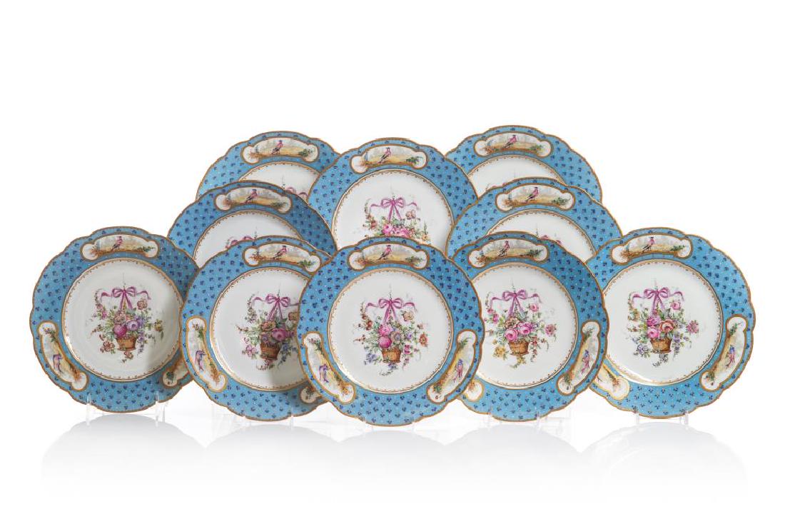 SET OF SEVRES STYLE CABINET PLATES: Ten hand painted porcelain dishes, Celeste Bleu and gilt tooled borders decorated with exotic birds surrounding a floral bouquet. Set bears crossed L mark with C from 1755. French, late 19th C. Dia. 2