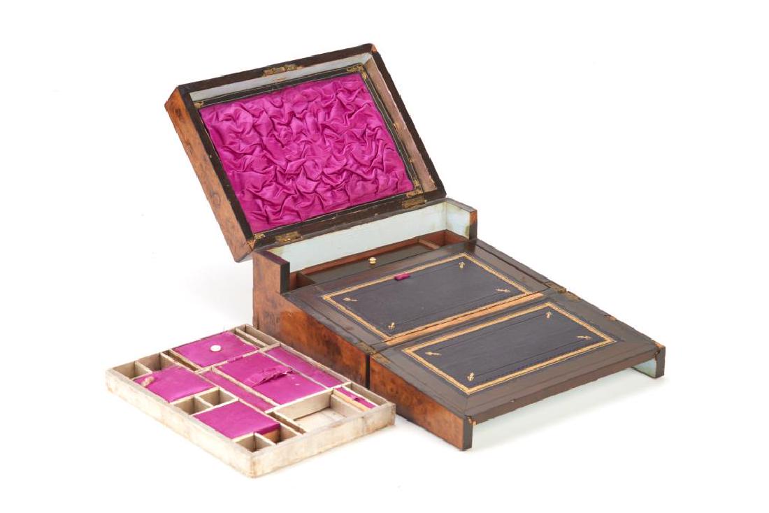 VICTORIAN TUNBRIDGE WARE PARQUETRY LAP DESK BOX: Geometric design in burlwood inlaid with mother of pearl hexagonal cartouche and key hole. Interior trays show several compartments lined with purple silk, and decorative black leather borders. H. 15 