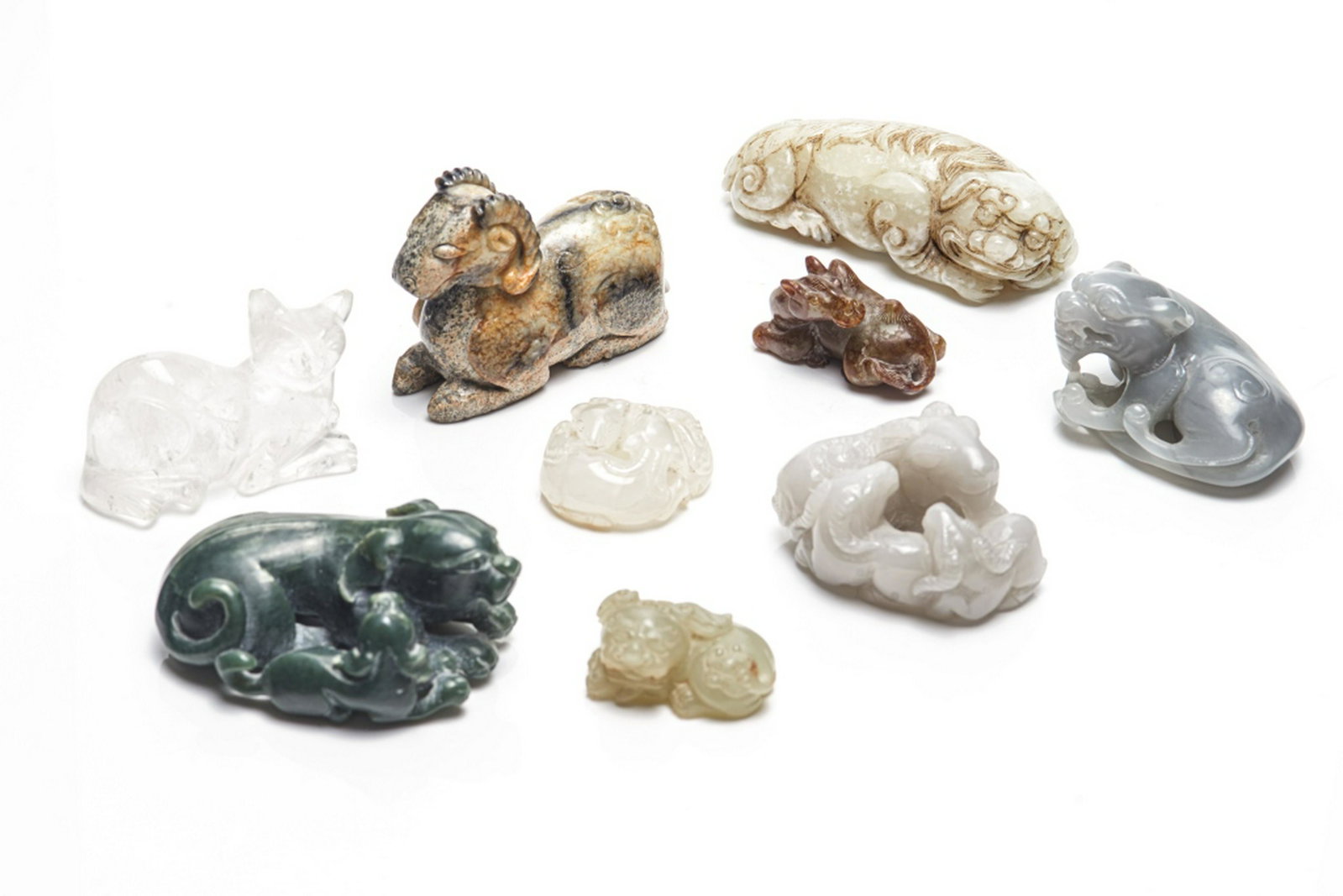 GROUP OF 9 CHINESE JADE AND STONE CARVINGS: Carved as single and group of animal figures. Tallest: 10.5cm (4 1/8 in.)