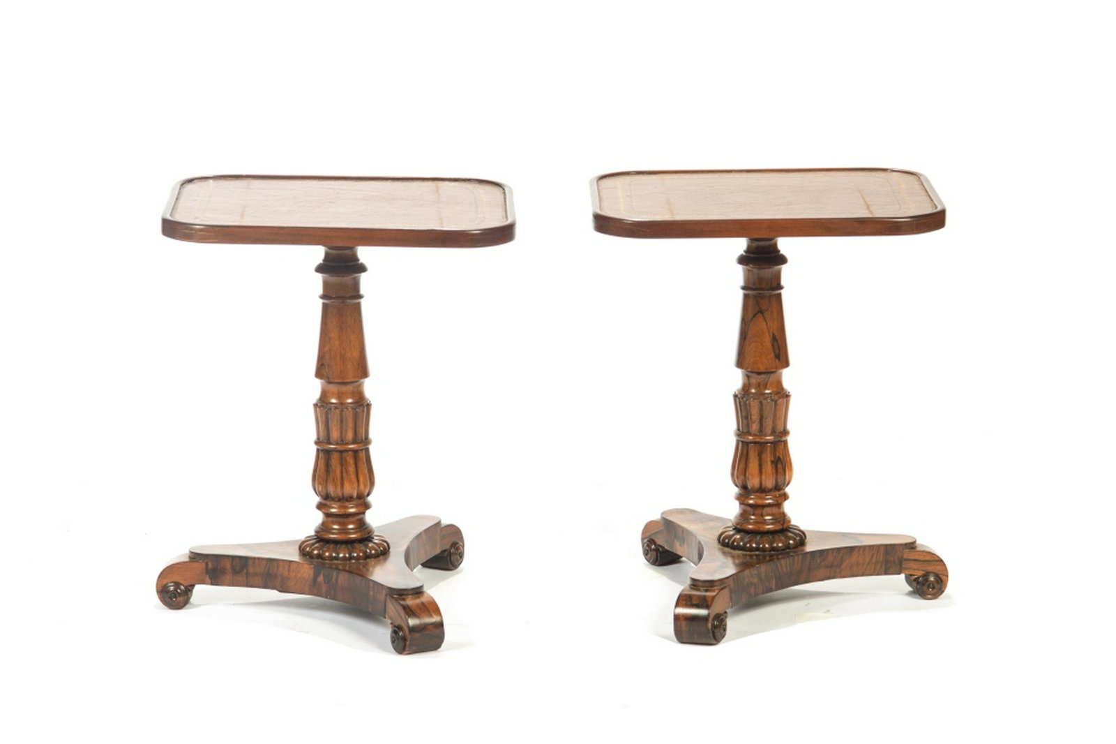 PAIR OF REGENCY ROSEWOOD SERVING TABLES: With tooled leather tops on a tripod base. H. 21 1/4 W. 14 1/8 D. 17 1/4in. BIDDERS LIVING OUTSIDE OF CANADA are warned to proceed with care before bidding on this lot as it cannot be shipped outside 