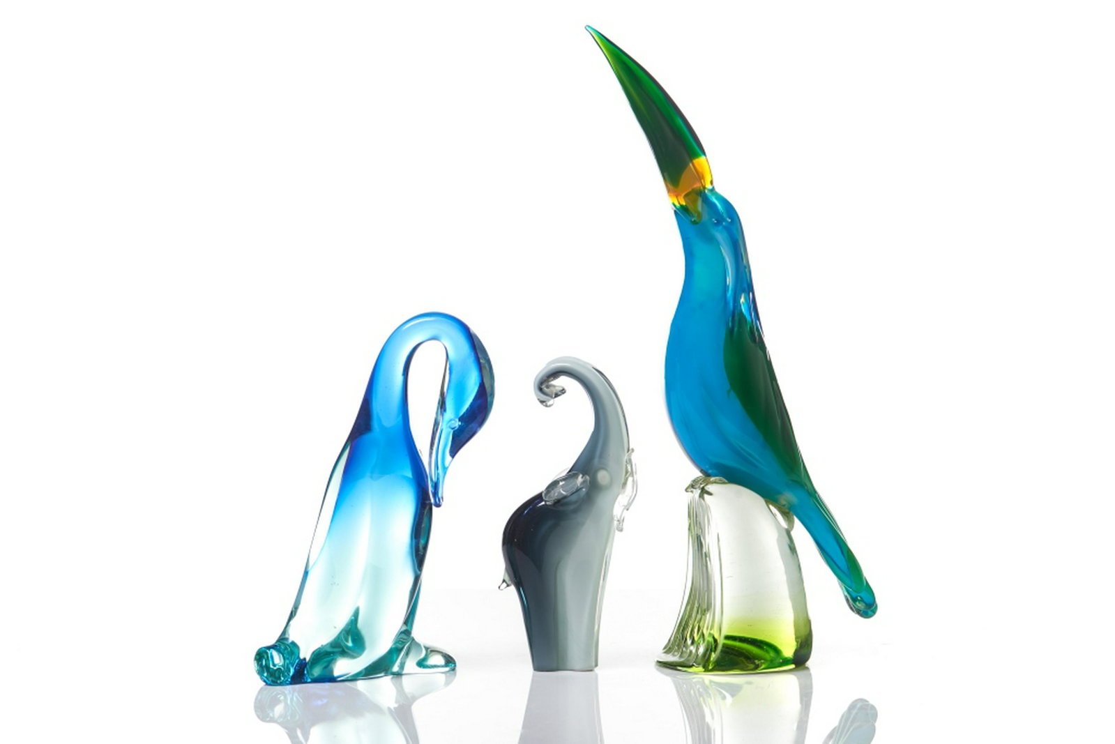 GROUP OF THREE VINTAGE MURANO GLASS ANIMAL FIGURES: Includes a multicoloured Toucan, an elephant and a blue duck. H. of tallest 48 cm (18 7/8 in)