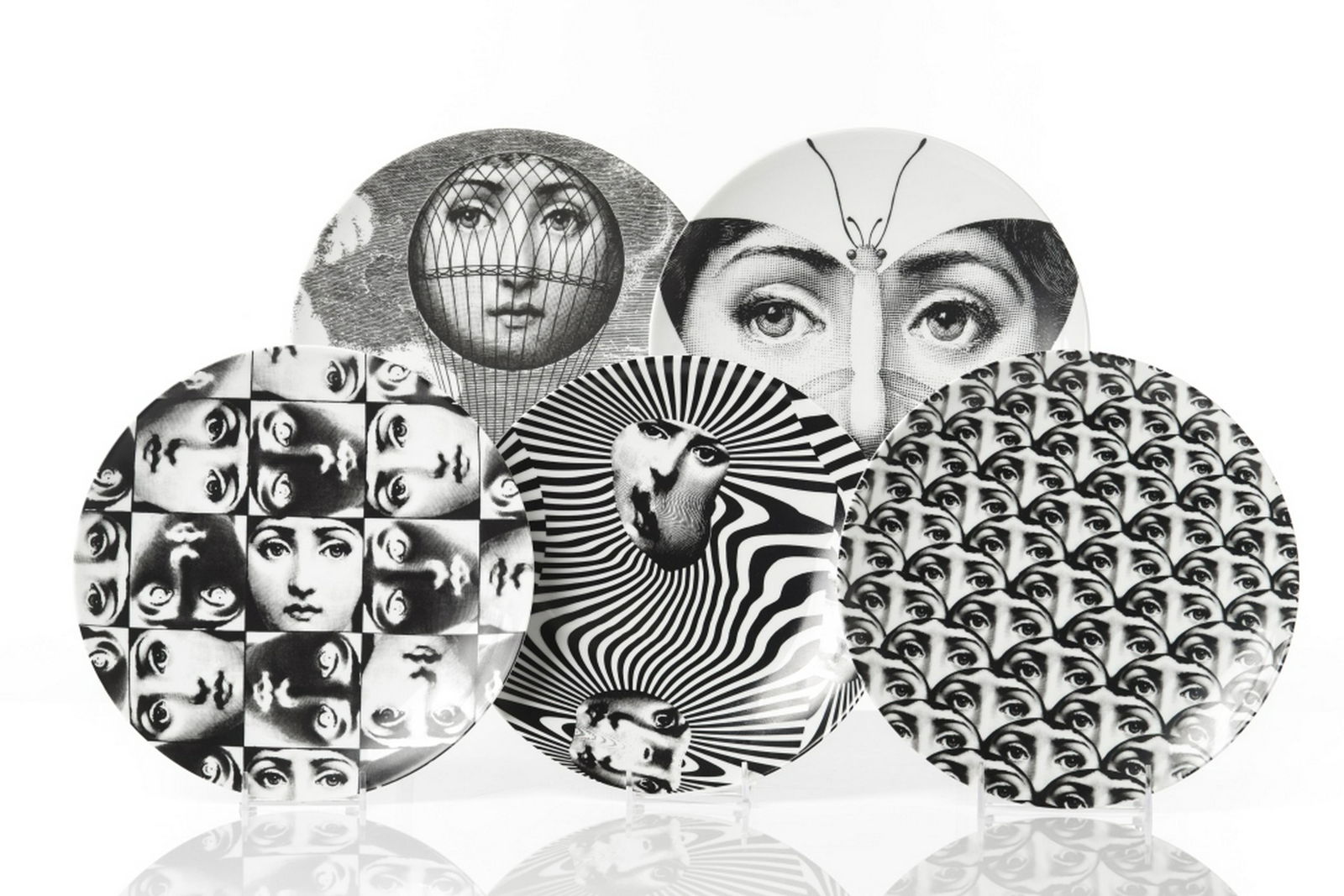 PIERO FORNASETTI FOR ROSENTHAL FIVE PLATES: "Tema e Variazioni" monochrome dishes diameter of each 26 cm (10 1/4 in). Includes design numbers 93, 96, 224, 275, 312