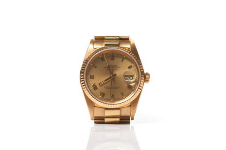 MEN'S YELLOW GOLD ROLEX WRIST WATCH: 18k yellow gold watch and band Rolex Oyster Perpetual Datejust Superlative Chronometer. With roman numeral dial. Rolex symbol on the dial, crown, band and movement. Interior serial number 1357361. Ban