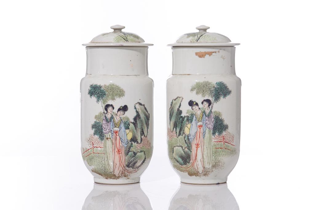 PAIR OF CHINESE PAINTED PORCELAIN JARS AND COVERS: Each painted with ladies in a rock and bamboo garden. Signed Liu Xiangtai. Late Qing dynasty. H. 26.5cm (10 1/2 in.) Provenance: From a Single Owner CanadianCollection, featuring objects Deasccessione