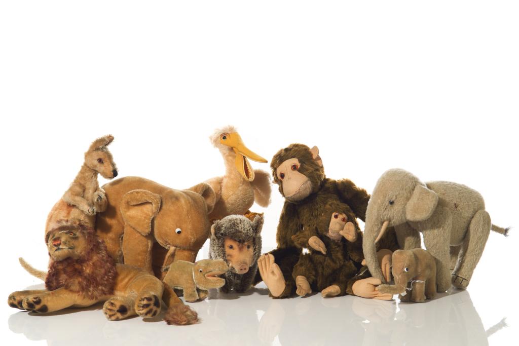 ASSORTED EXOTIC STEIFF AND FARNELL STUFFED ANIMALS: Ten vintage stuffed animals including a pelican, a lion, a hippo, a kangaroo, a monkey, two elephants, and a warthog. Miniature sized. H. 8.5 in. (elephant)