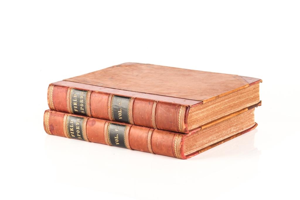 TWO VOLUME SET OF LEATHER BOUND FIELD SPORTS BOOKS: And Veterinary Knowledge. Likely circa early 19th century, inscribed inside cover E. M. Mansel Pleydell. Includes coloured illustrations throughout, edited by Henry Downes Miles. H. 31 cm W. 25 cm (12