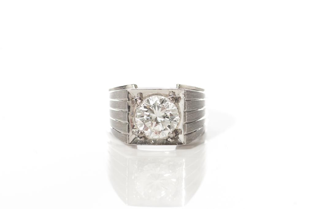 GOLD & DIAMOND SOLITAIRE RING: Ring intended for a female in a male signet style stamped 14k white gold with a satin finish band accented with lines and set with a round brilliant cut central diamond, 1.65 ct. Total weight of diamo