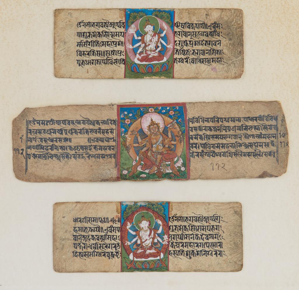 18TH C. NEPAL PAINTED BUDDHIST MANUSCRIPT LEAVES: Painted with Vasudhara. Ink and gouche on paper, framed. Largest leaf size: 7.5 x 26.5cm (3 x 10 1/2 in.) Frame size: 36 x 37.5cm (14 1/4 x 14 3/4 in.)