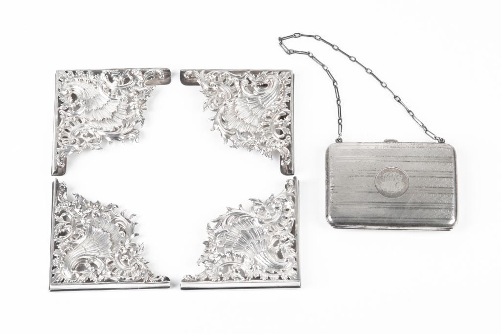 GROUP OF FIVE SILVER ACCESSORIES: Comprising four pieces of English silver as decorative corners to a frame (missing frame), indistinctly marked with a lion passant, and a Birks silver case with chain and fitted leather interior for c
