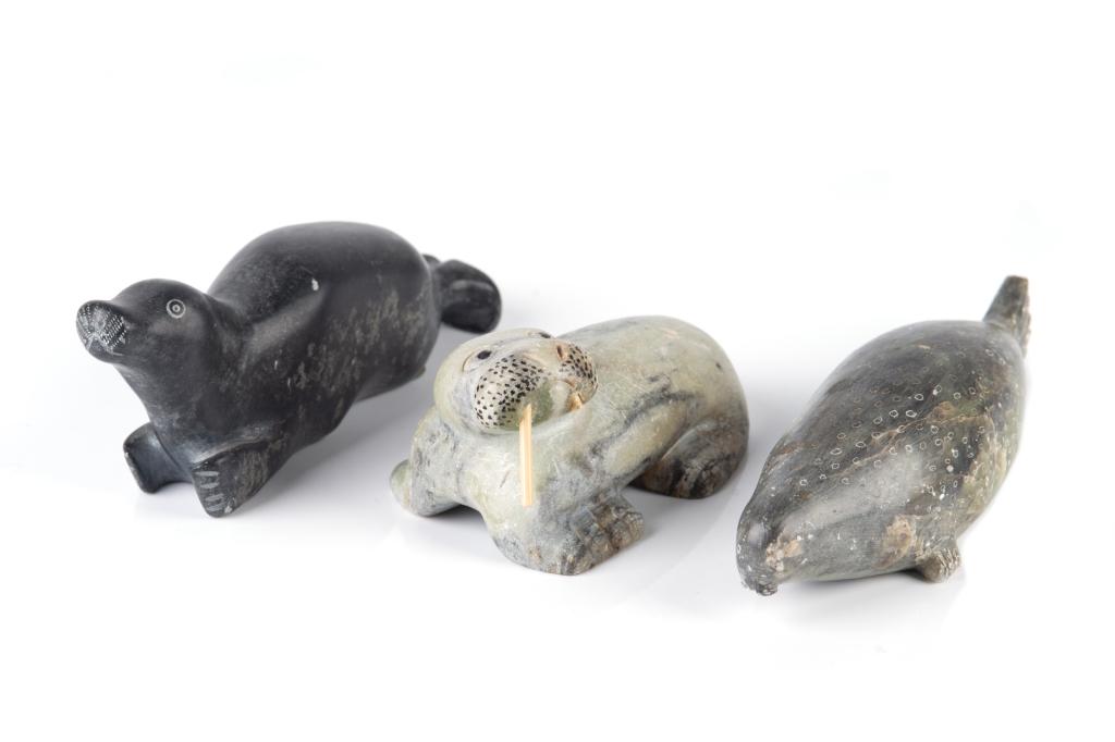UNIDENTIFIED INUIT ARTISTS: Three signed Inuit stone carvings: seal, walrus and sea leopard. Two signed in syllabics and one signed in roman (Peter) with disc number to bases. L of leopard seal: 8 1/2 in. (21.6 cm) Condition not