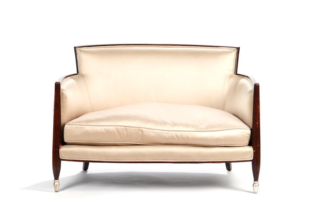 FRENCH ART DECO PERIOD SETTEE: A 1920s love seat with pearl grey satin upholstery, in the manner of Jules Leleu. H. 30 W. 43 1/2 D. 33 1/2 in.
