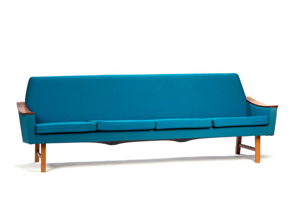 P.I. LANGLO NORWEGIAN TEAK SOFA: Three person sofa with vivid blue upholstery. On teak legs and with teak arm rests. H. 29 W. 87 D. 28 in.