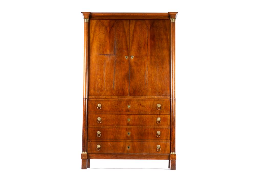 19TH C FRENCH MAHOGANY LINEN PRESS: Lower four drawer section with lion mask pulls. Upper cabinet with two glazed doors and adjustable shelves.H.86.25 x W. 53 x D. 22 in.
