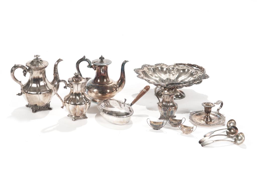 LOT OF SILVERPLATE TABLE ACCESSORIES: Including a water pitcher, two teapots, a creamer, a candlestick, three slats, a crumb scoop, three spoons, a swing handle raised basket, and a pierced dish. Condition report available upon request.